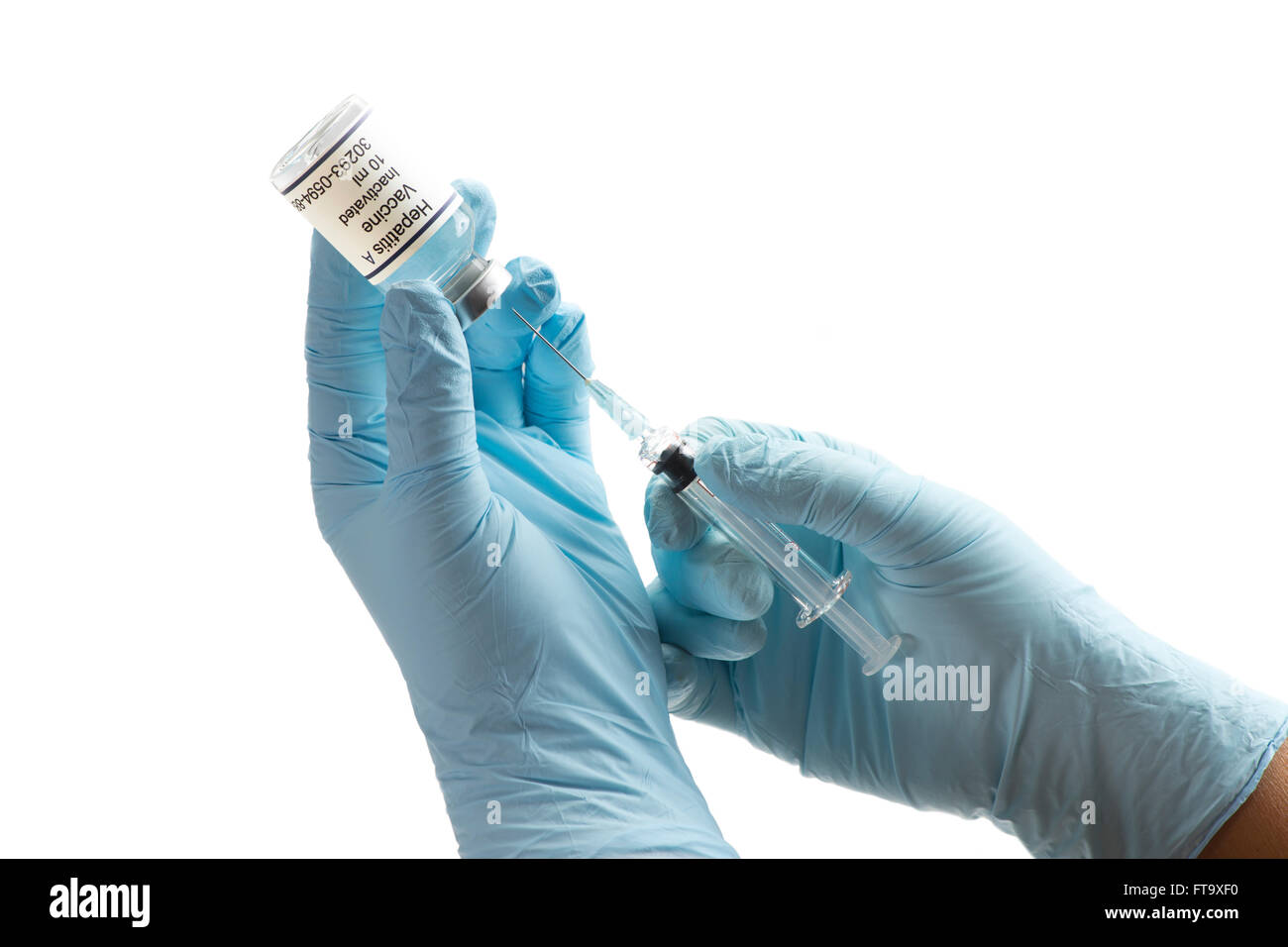 Nurse prepares Hepatitis A vaccine for injection. Label fictitious, created by photographer. Stock Photo