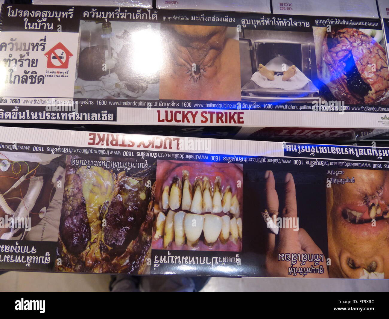 Thai cigarette covers showing various kinds of cancer Stock Photo