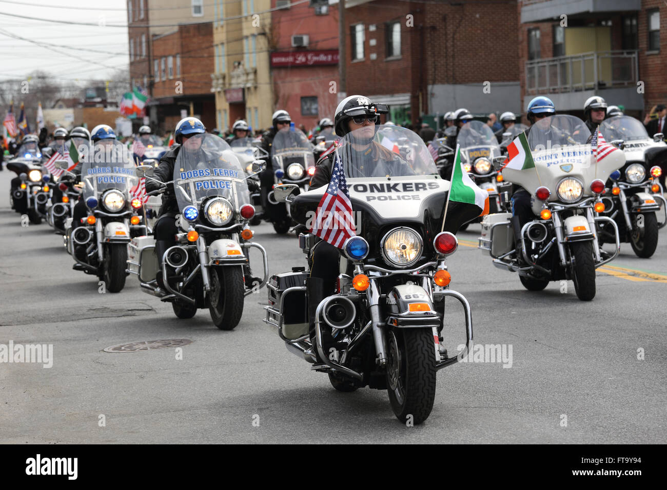 Police motorcycle brigade leads St. Patrick's Day parade Yonkers New York Stock Photo