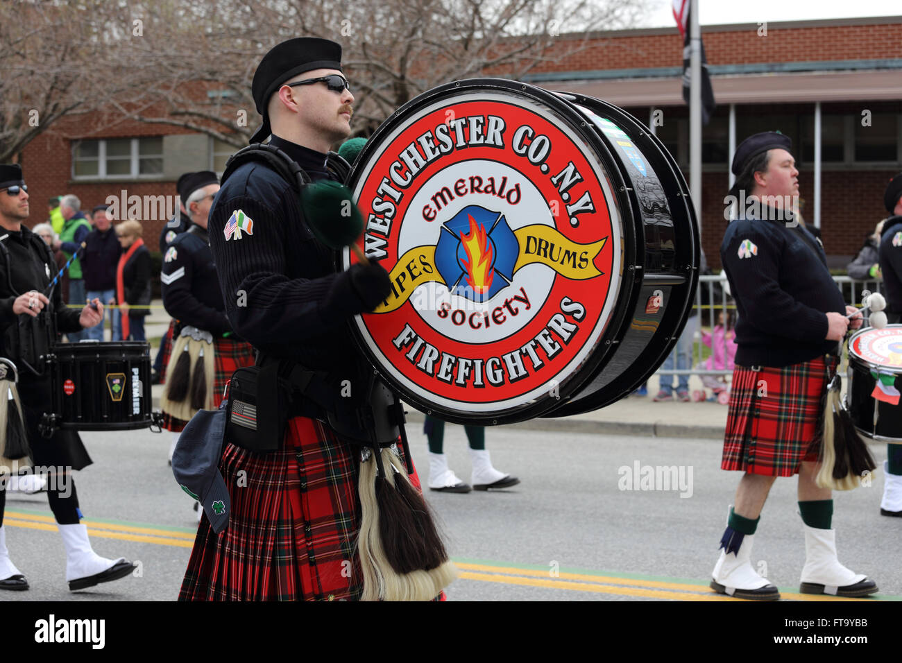 Pipes and Drums band marching in St. Patrick's Day parade Yonkers New York Stock Photo