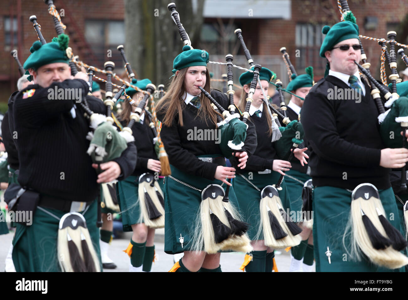 Pipes and Drums band marching in St. Patrick's Day parade Yonkers New York Stock Photo