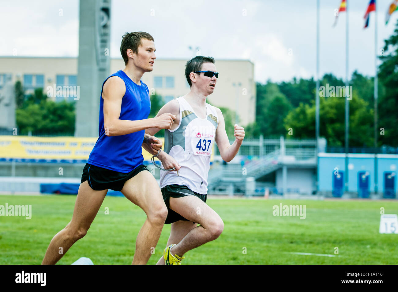 Chelyabinsk, Russia - July 05, 2015: blind men athletes run 800 meters during Championship Russia on track and field athletics Stock Photo