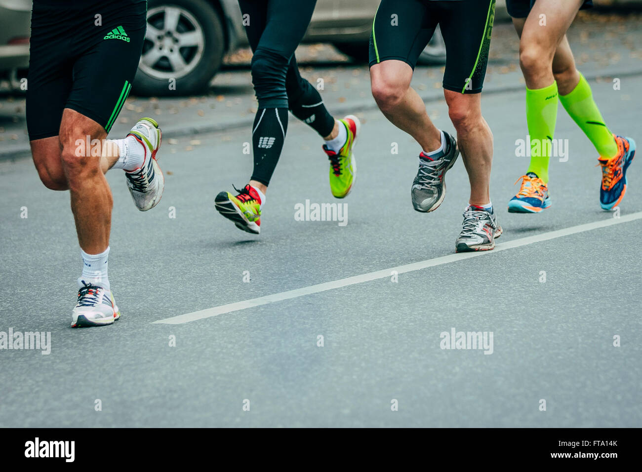 group of joggers running down the street during Chelyabinsk marathon Stock Photo
