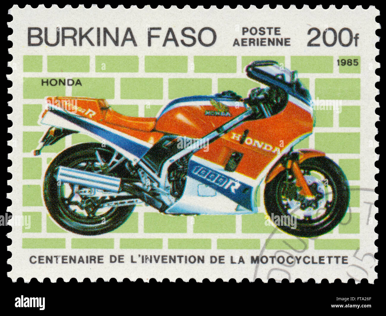 BUDAPEST, HUNGARY - 18 march 2016:  a stamp printed in Burkina Faso shows image of a vintage motorcycle, Honda, circa 1985 Stock Photo