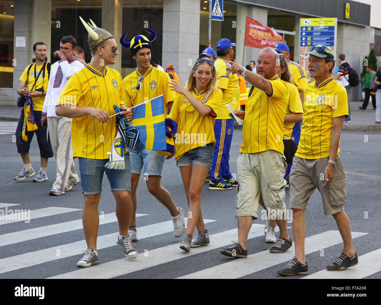 KYIV, UKRAINE - JUNE 11, 2012: Swedish football fans walk on the streets of Kyiv city before UEFA EURO 2012 game against Ukraine at Olympic stadium Stock Photo