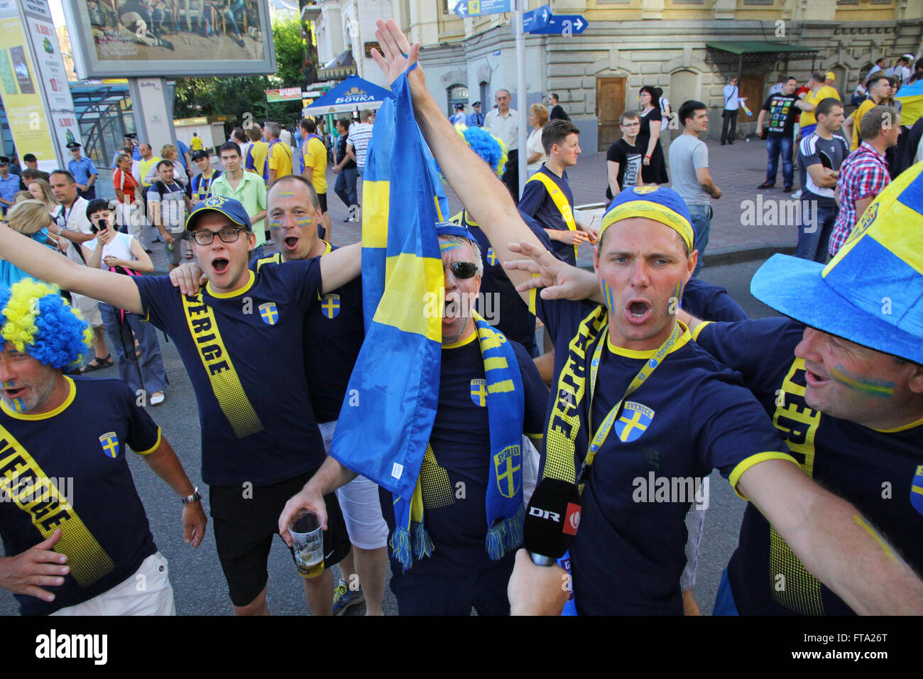 KYIV, UKRAINE - JUNE 11, 2012: Swedish football fans walk on the streets of Kyiv city before UEFA EURO 2012 game against Ukraine at Olympic stadium Stock Photo