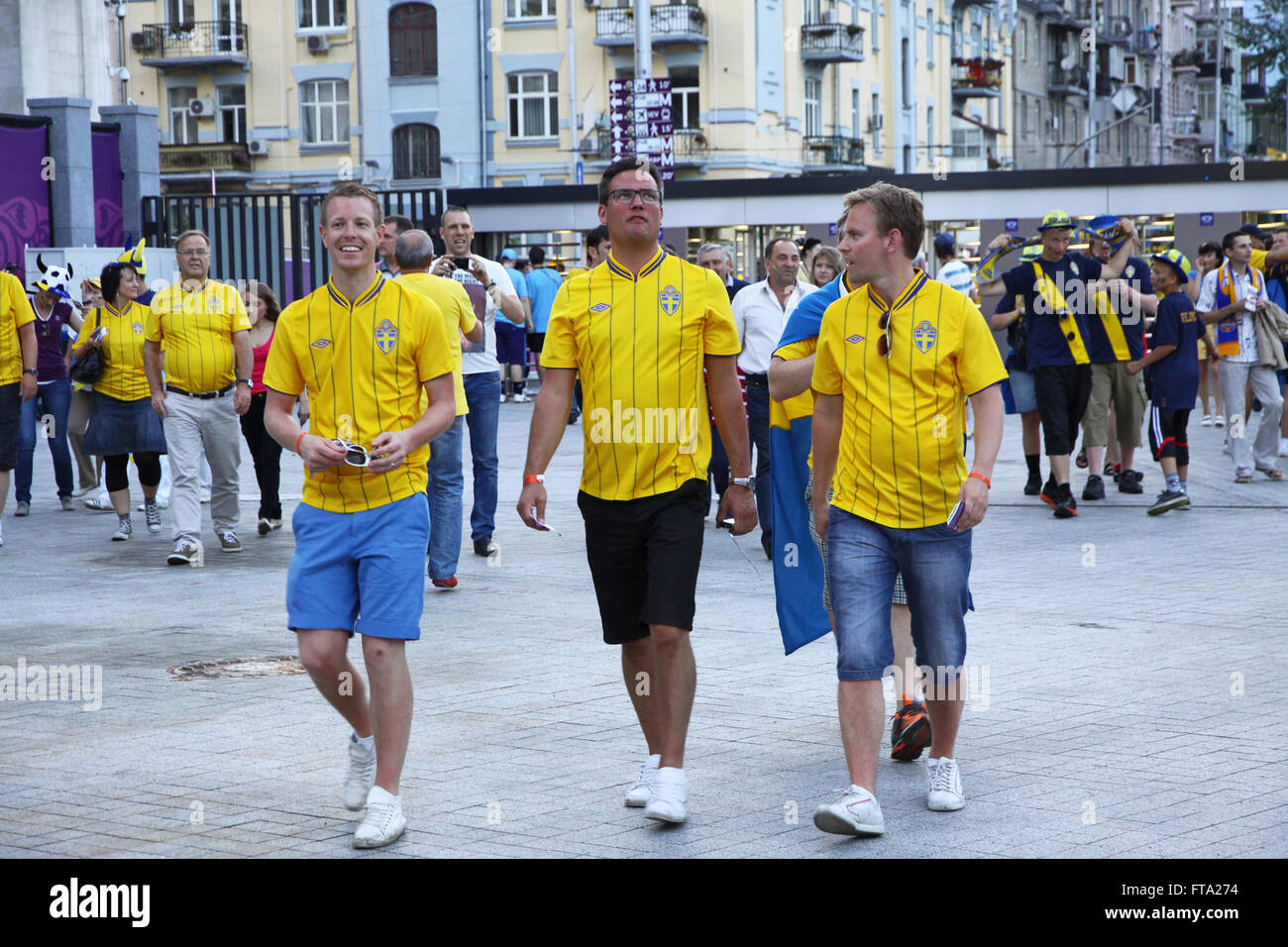 KYIV, UKRAINE - JUNE 11, 2012: Swedish football fans walk on the streets of Kyiv city before UEFA EURO 2012 game against Ukraine Stock Photo