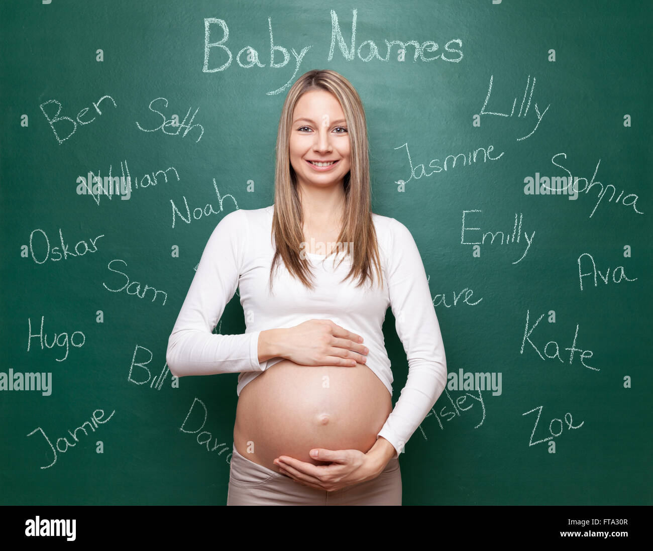 Pregnant woman trying to choose a name for her baby Stock Photo