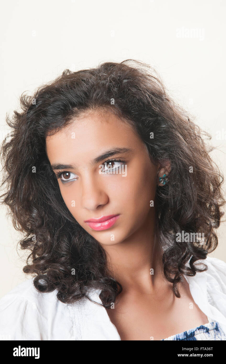 Portrait of a pensive teenage girl looking away Stock Photo - Alamy