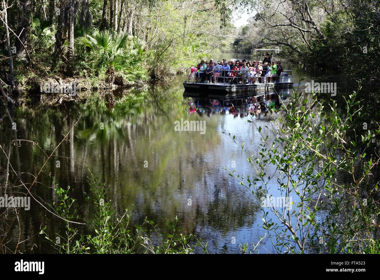 Ferry taking visitors to the entrance of Ellie Schiller Homosassa Springs Wildlife State Park Stock Photo