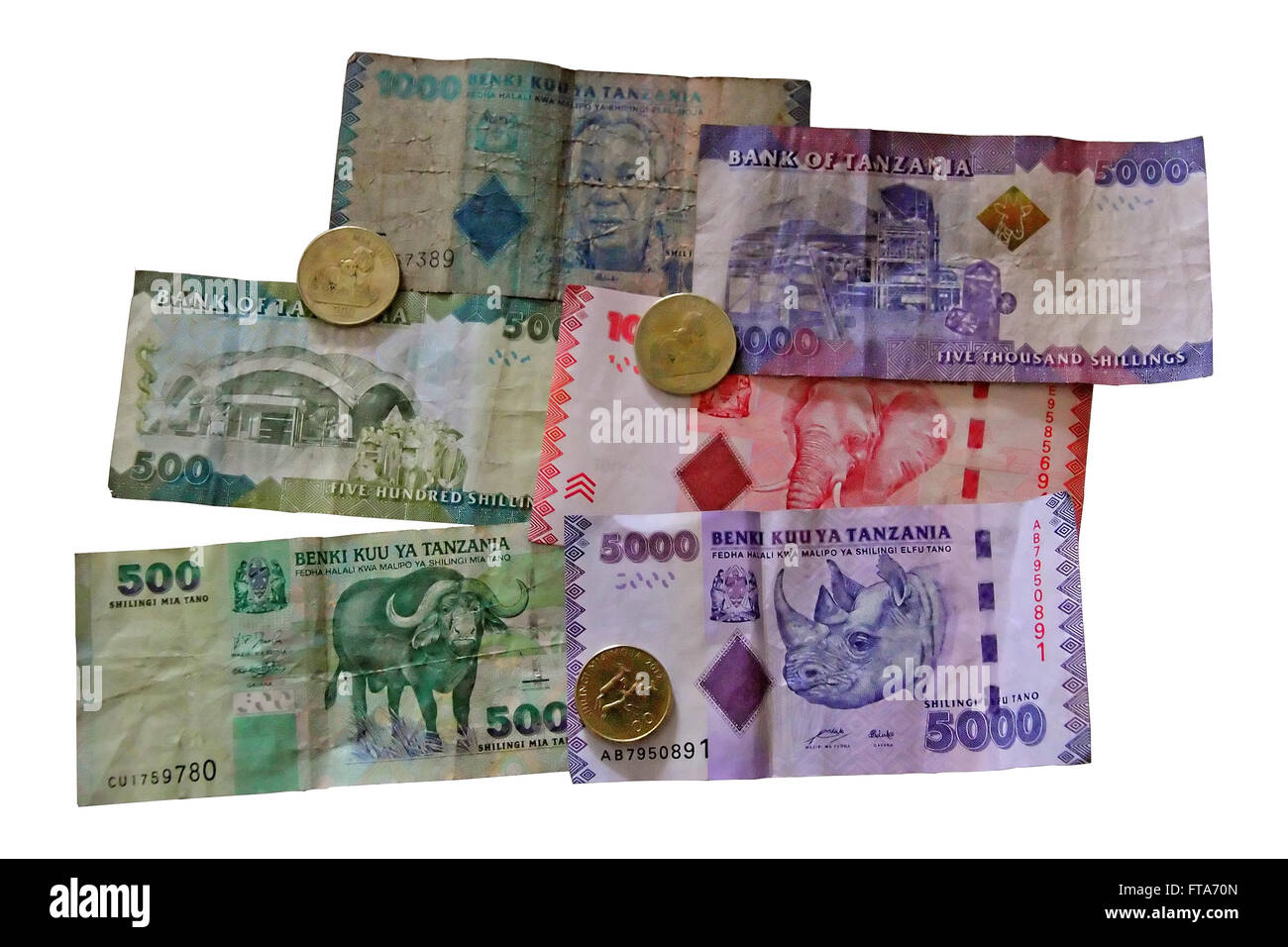 An isolated collection of dirty old Tanzanian money bank notes and