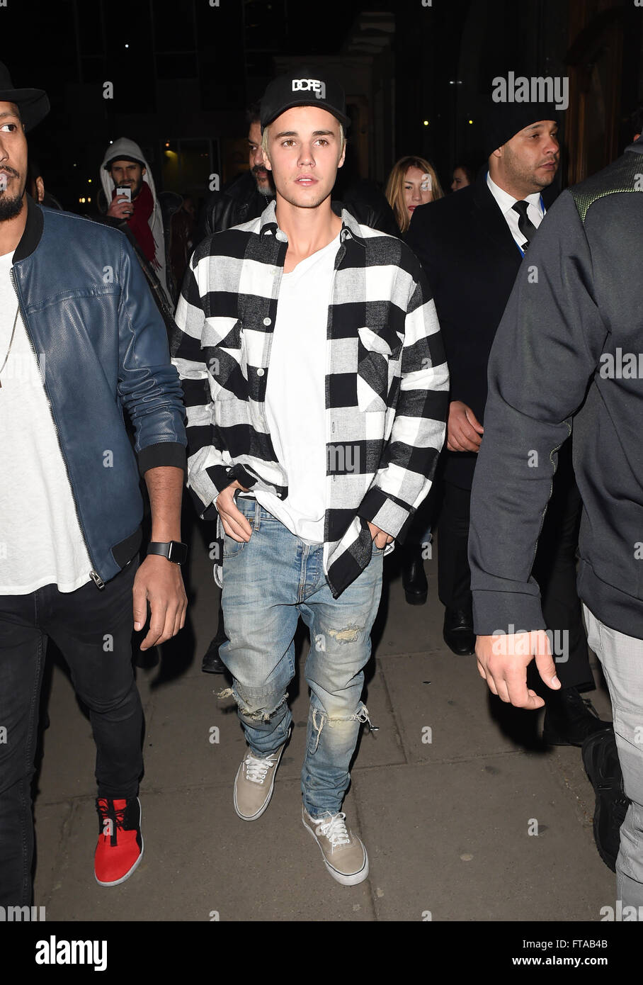 Justin Bieber Seen Arriving At Tape Nightclub In London Ahead Of His Performance At The 16 Brit Awards Justin Was Seen Wearing A Baseball Cape With The Slogan Dope On As He