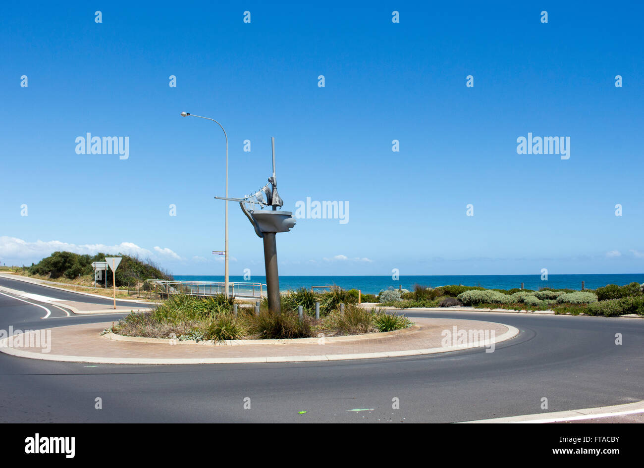 Roundabout on Ocean Beach Bunbury South Western Australia is a half boat with Mrs Scott's washing hanging on a line. Stock Photo