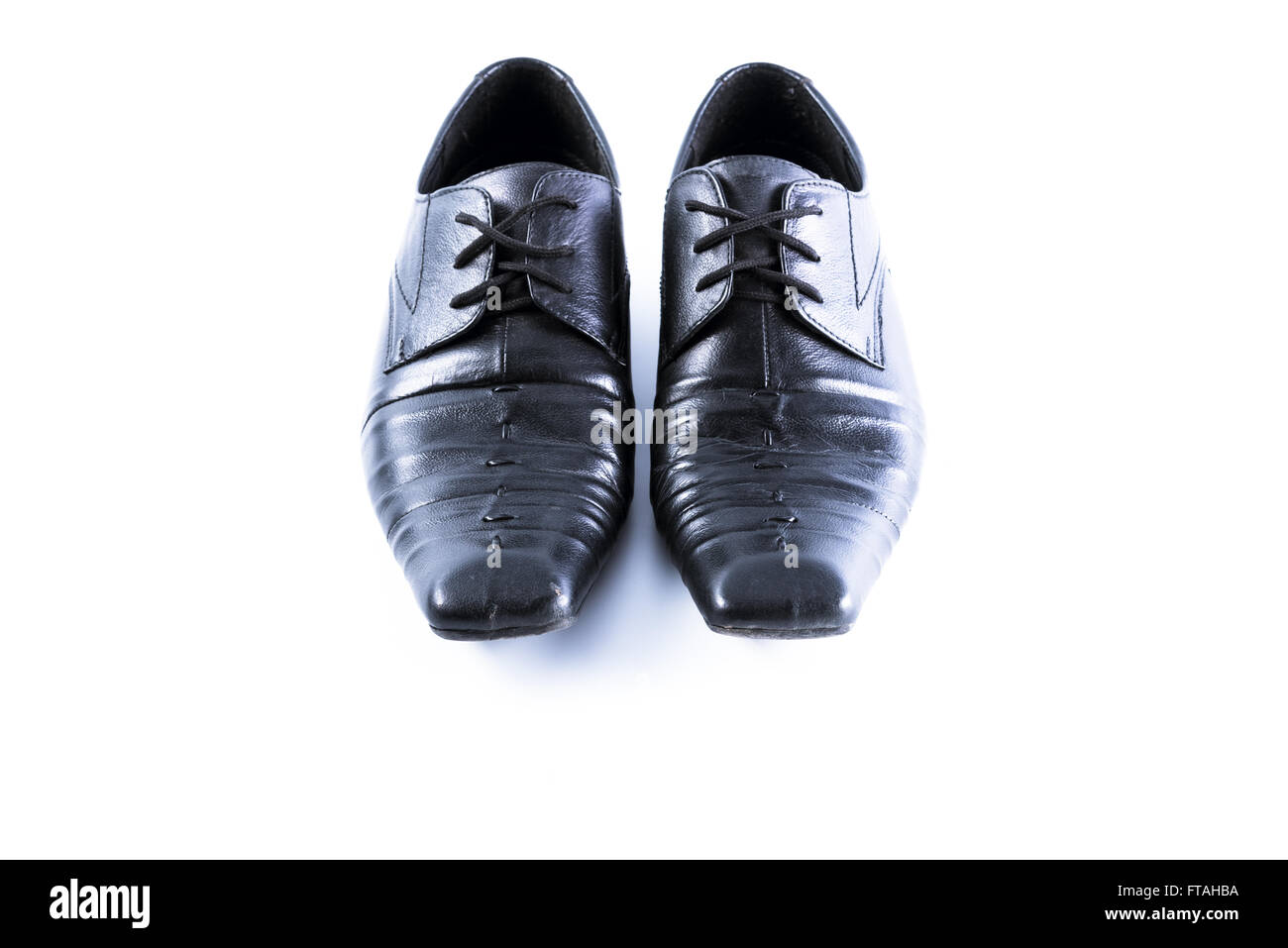 Used men shoes on white background Stock Photo - Alamy