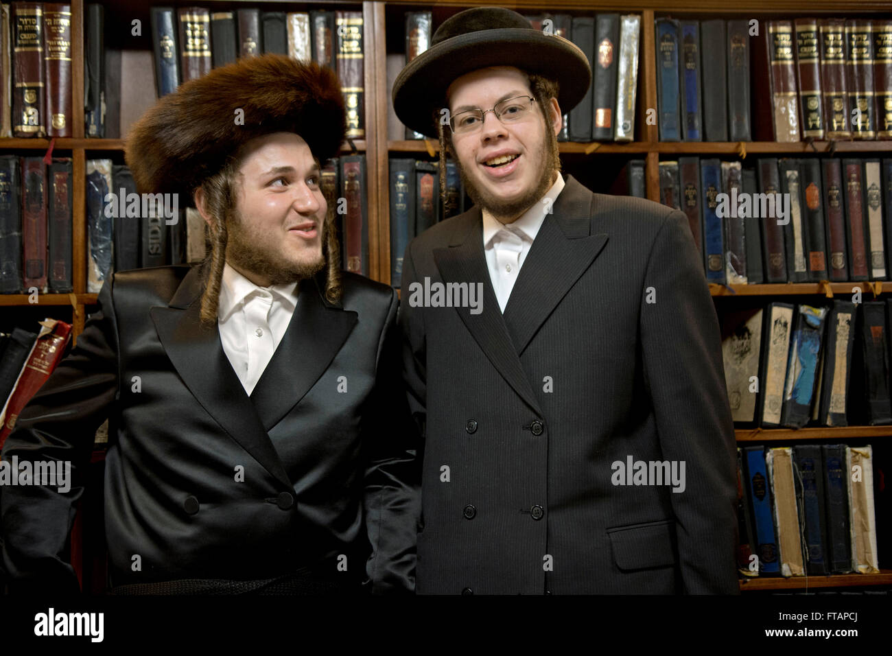 2 religious Jewish young men at a synagogue in Brooklyn, New York on Purim. They were collecting donations for the poor. Stock Photo