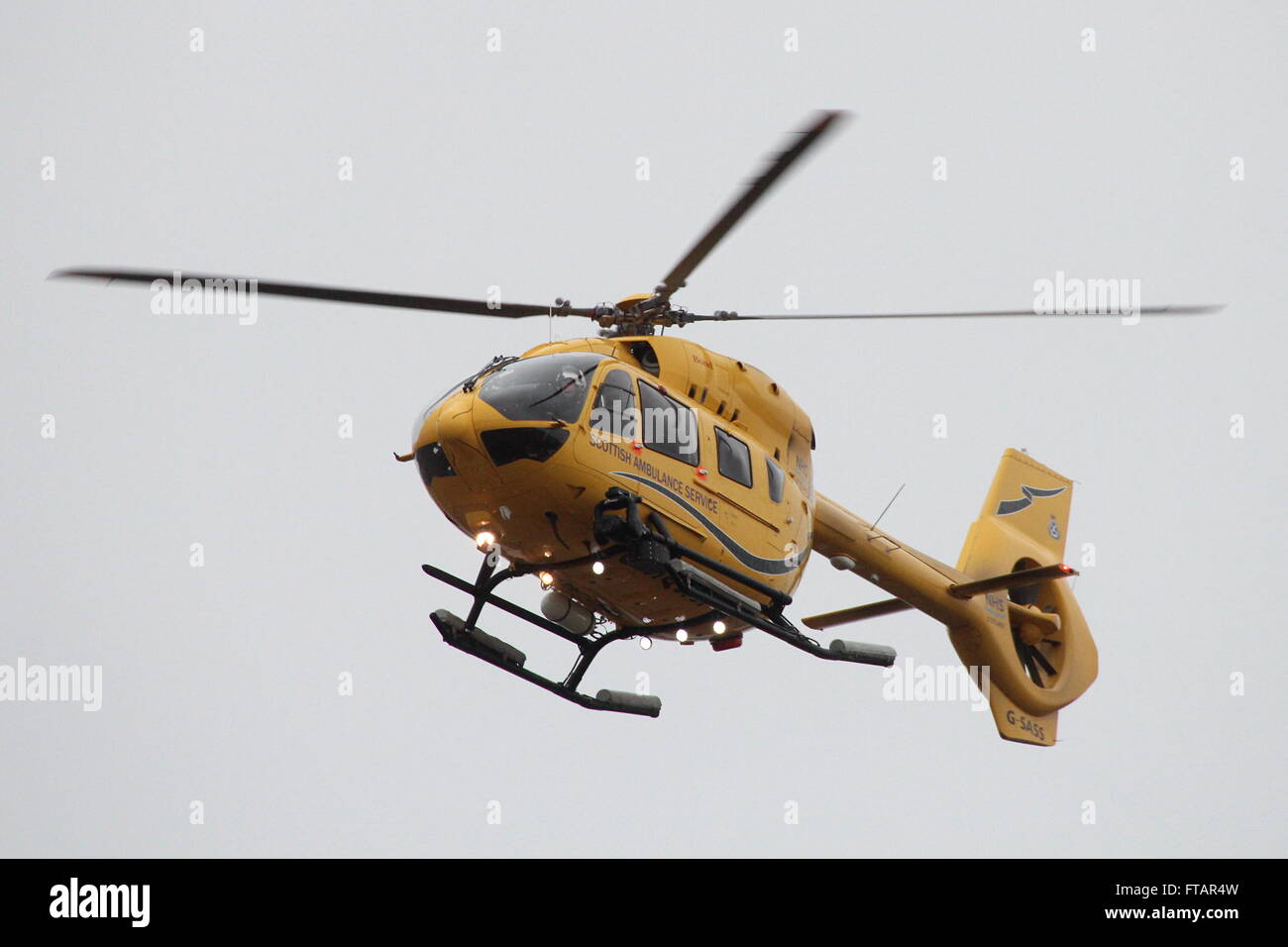 G-SASS, a Eurocopter EC145 (Airbus H145) operated by Bond Helicopters for NHS Scotland's Air Ambulance Service, at Prestwick Airport in Ayrshire. Stock Photo