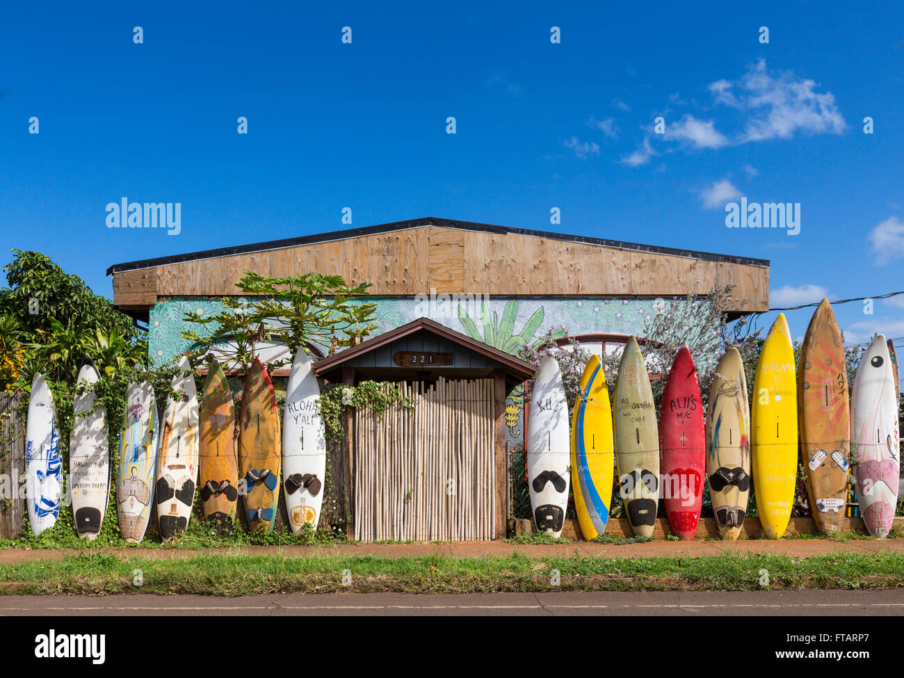 A fence made out of windsurfing boards: unique, fun, local travel sights in Paia, Maui, Hawaii Stock Photo