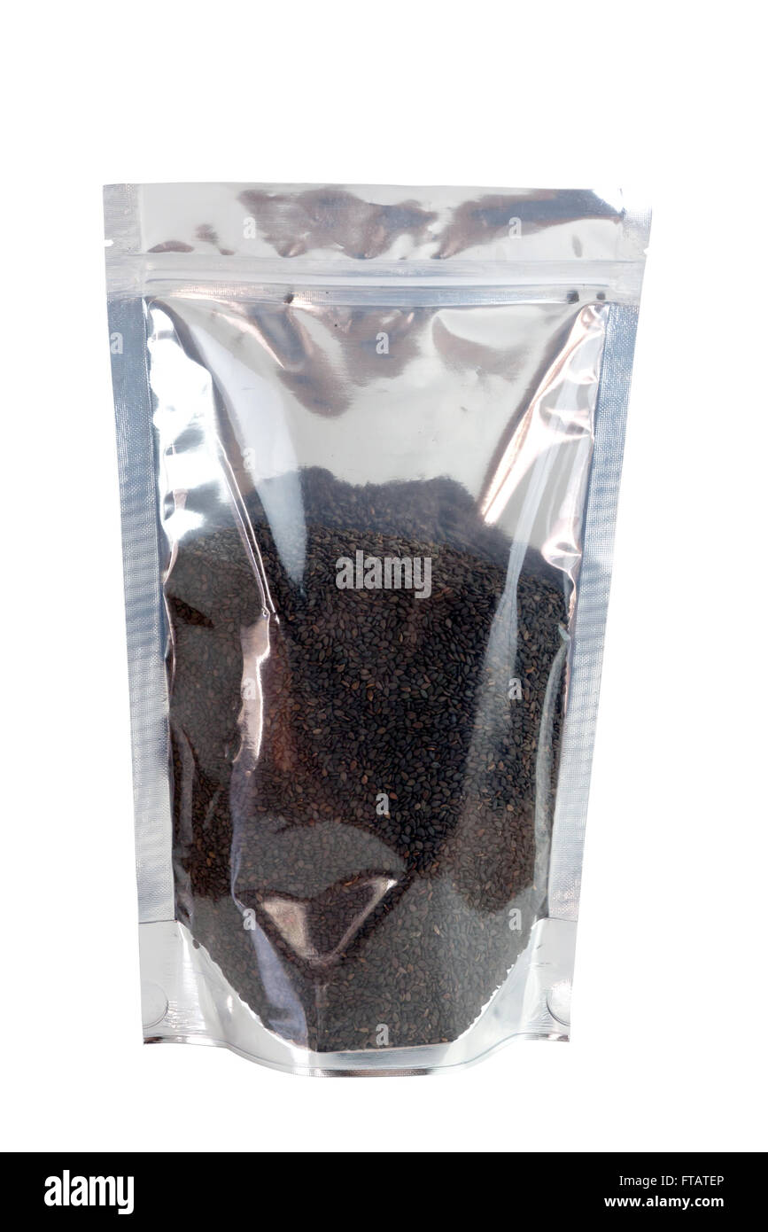 Black sesame seeds in packaging foil zip lock bag. Isolated on white ...