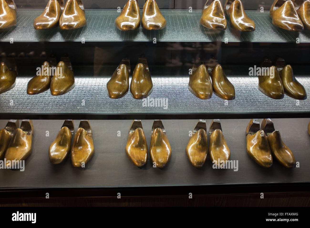 A display of shoe moulds ready for custom made shoes Stock Photo