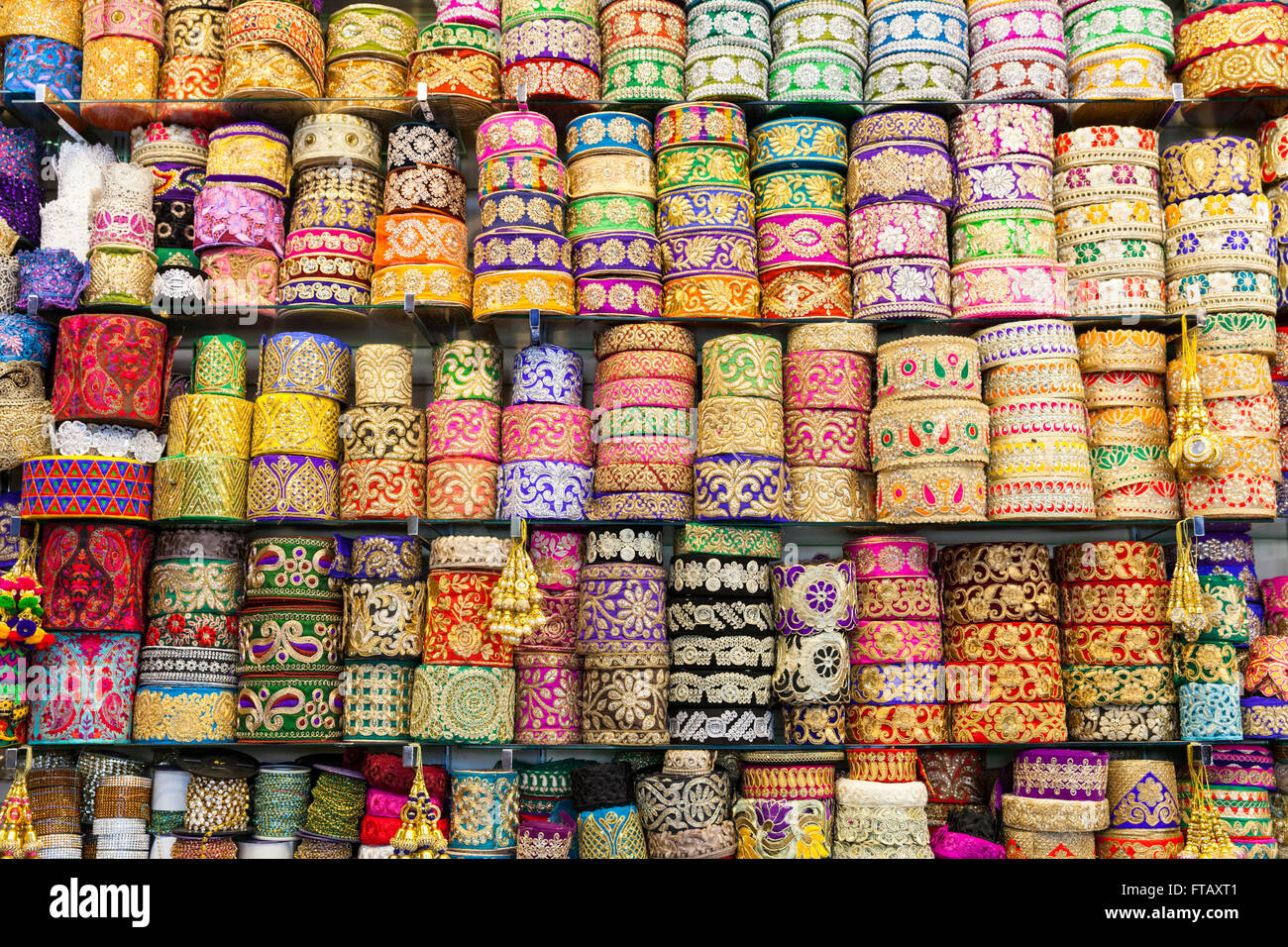 Display of colourful Asian and Oriental fabric trims, embroidery  and patterned edging Stock Photo