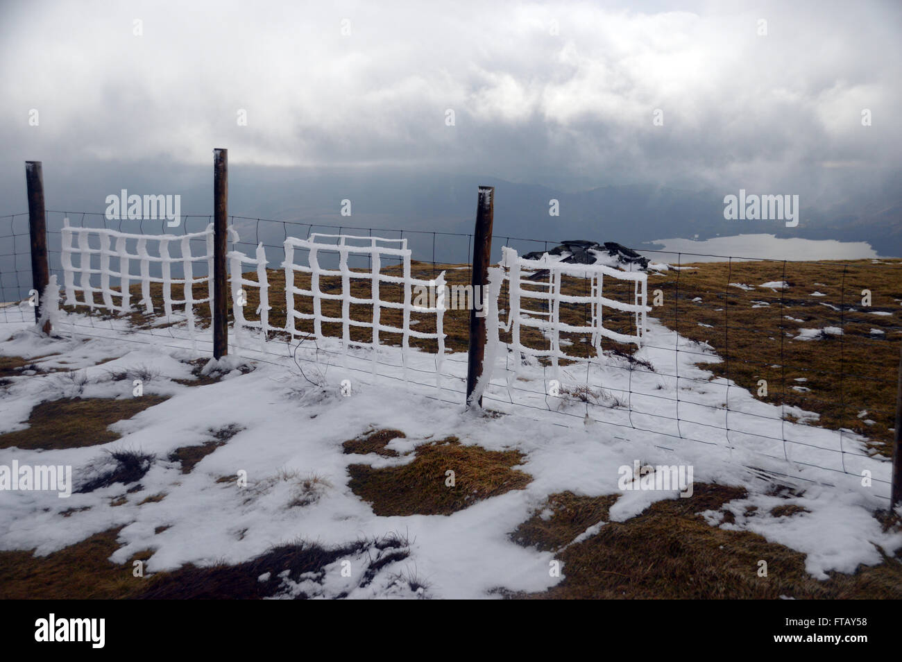 Ice Covered Wire Fence on the Summit of Jenkins Hill Cumbria UK. Stock Photo