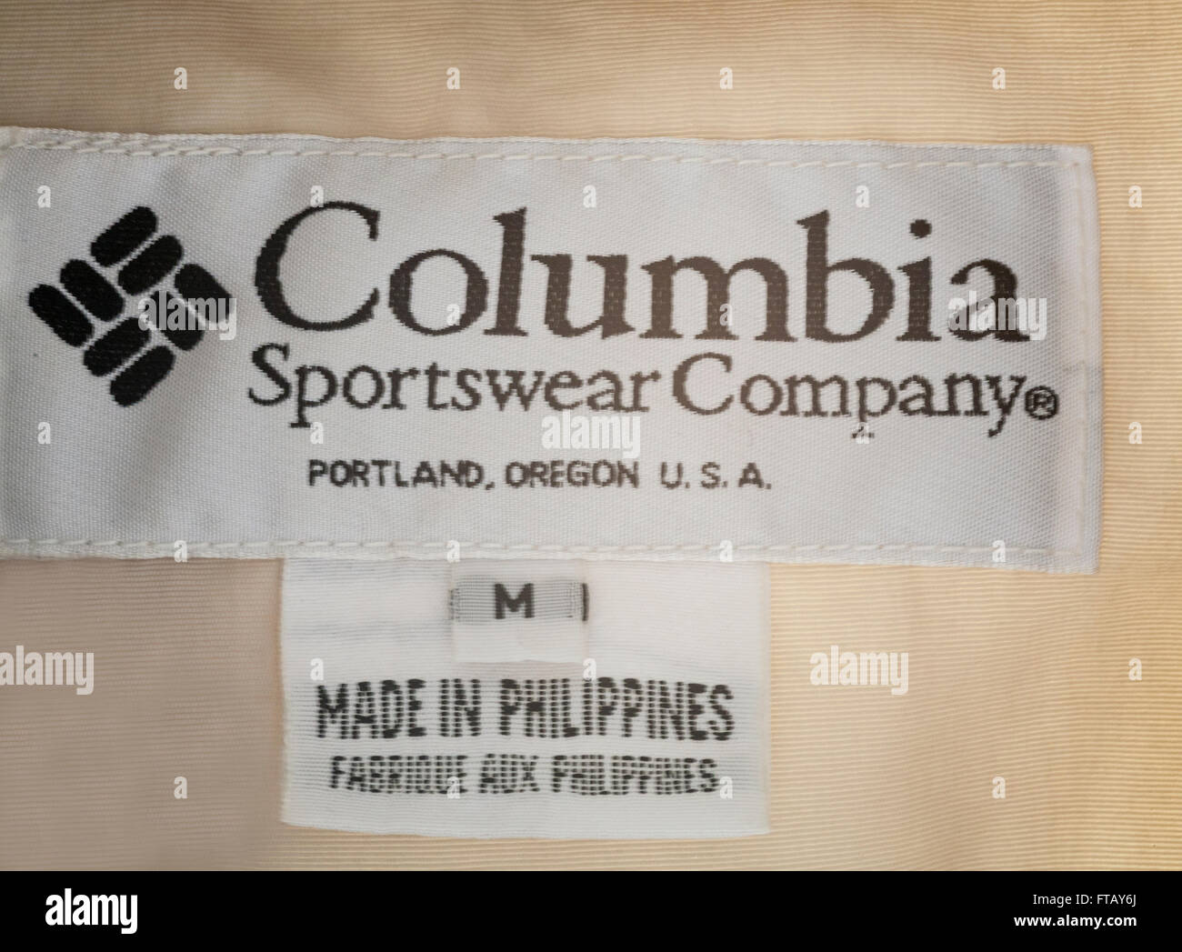 Close up label in garment Made in Philippines sold by Columbia Sportswear  Company Portland USA Stock Photo - Alamy