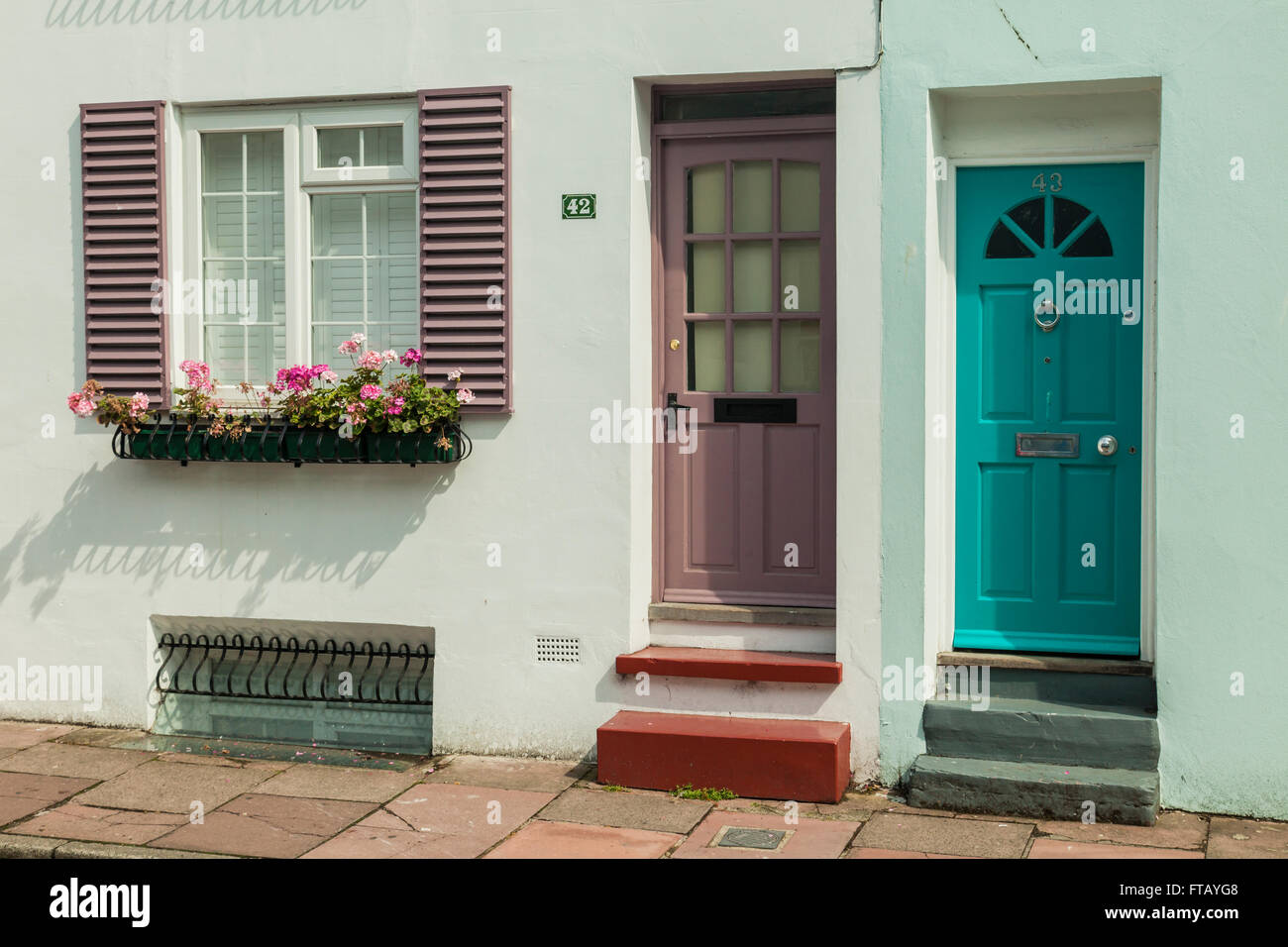 Painted doors on a street in Brighton, East Sussex, England. Stock Photo