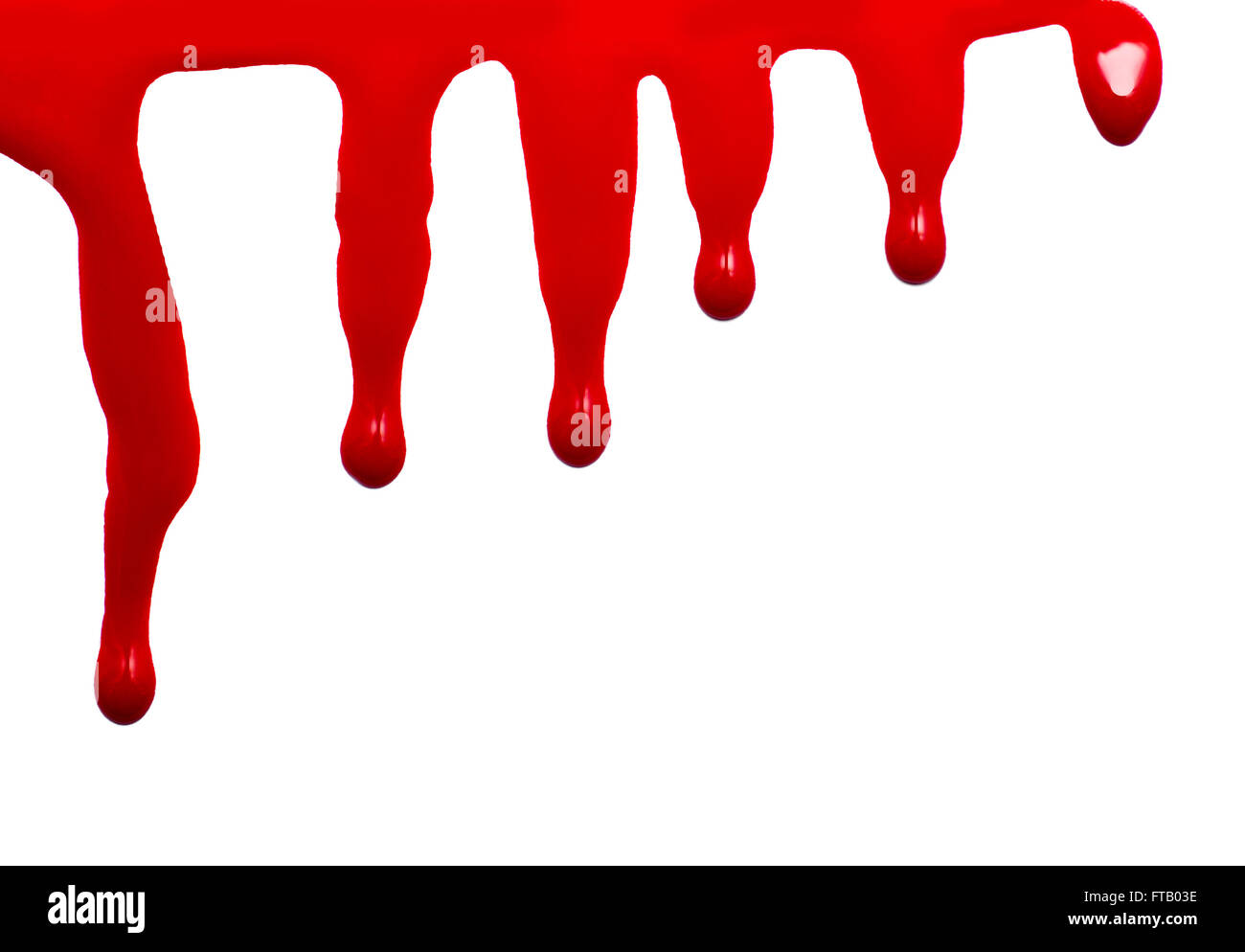 close up of red paint leaking on white background Stock Photo
