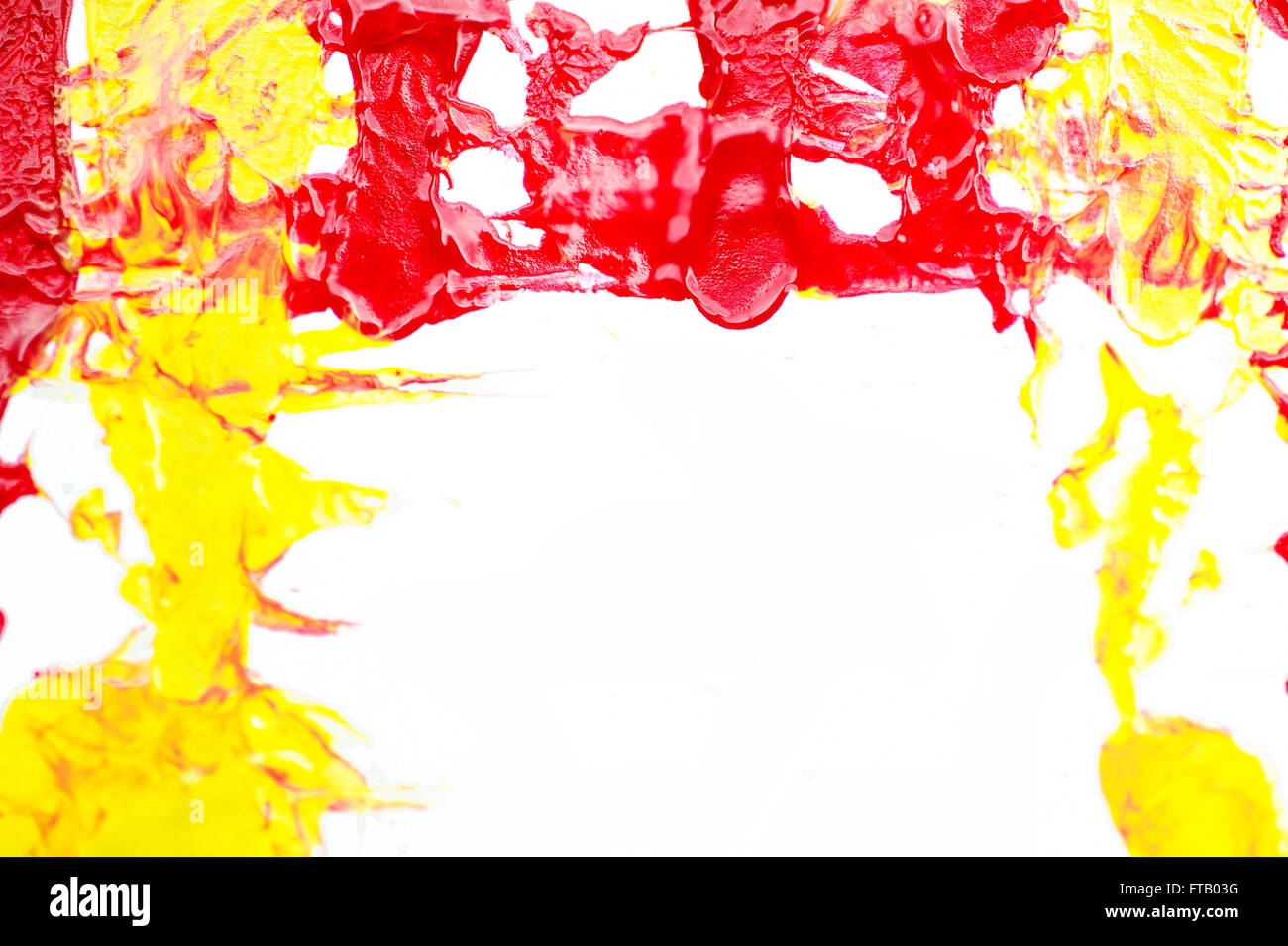 red and yellow paint on a white background Stock Photo - Alamy