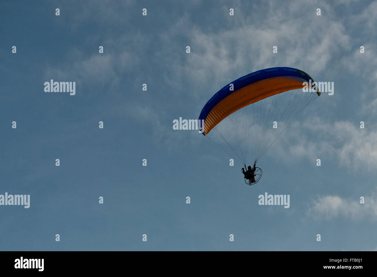 A Paraglider flying above Skegness Beach, Lincolnshire, UK Stock Photo