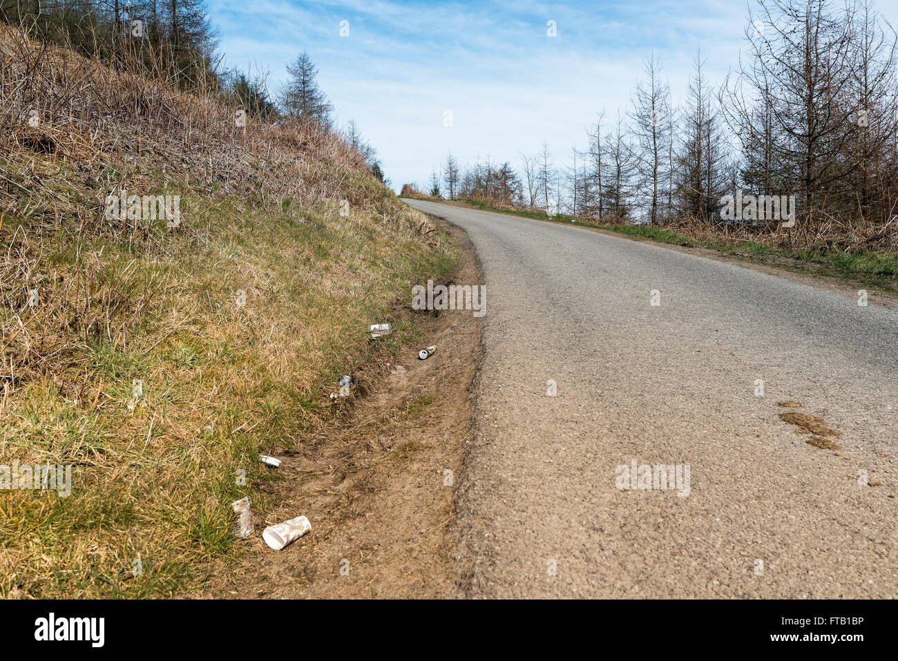Litter thrown from passing cars in the beautiful St Gwynno Forest. Stock Photo