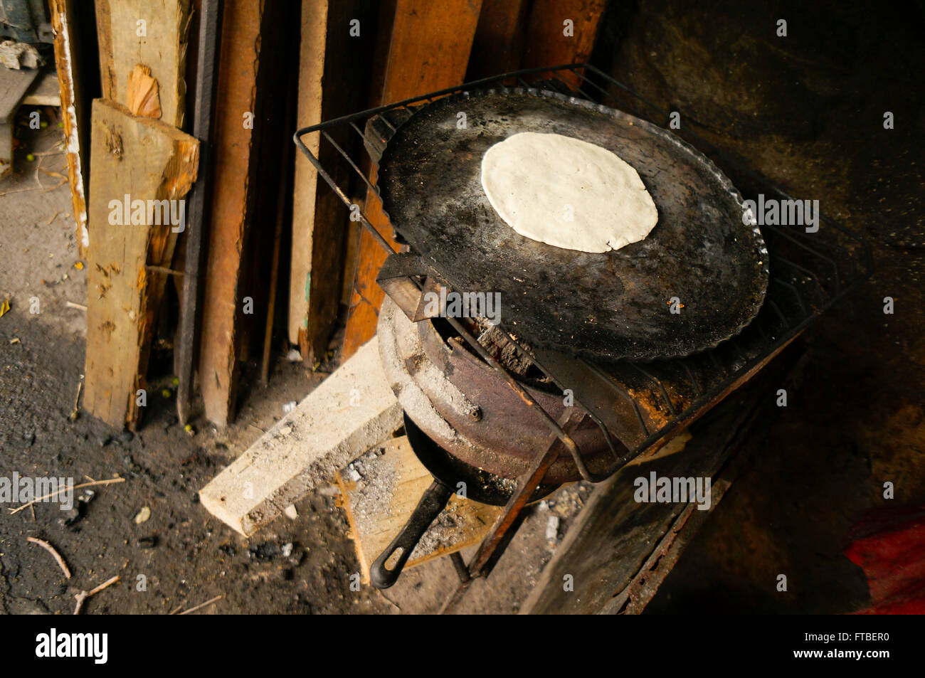 tortilla cooking on wood burning stove in Acapulco, Mexico Stock Photo