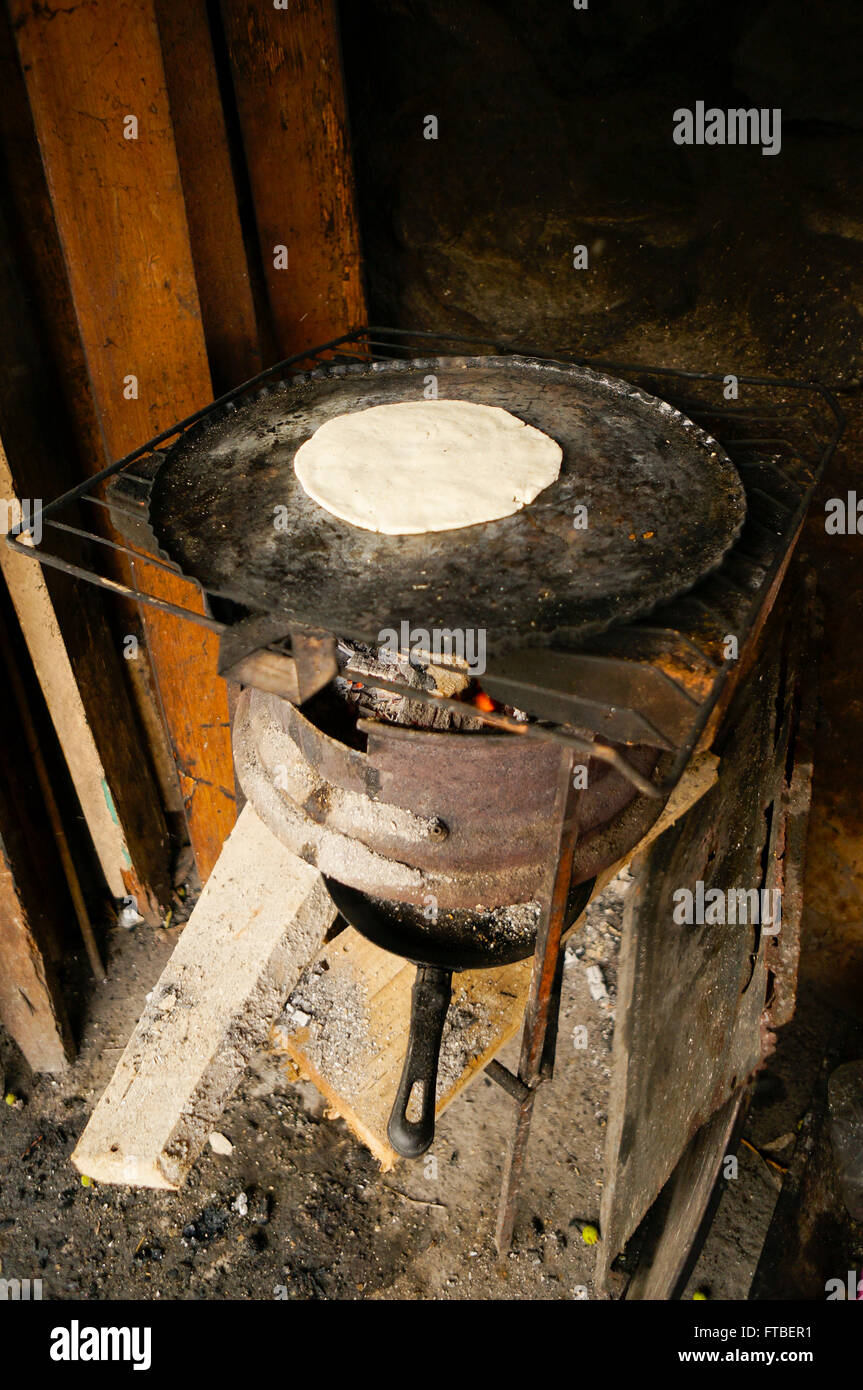 tortilla cooking on wood burning stove in Acapulco, Mexico Stock Photo