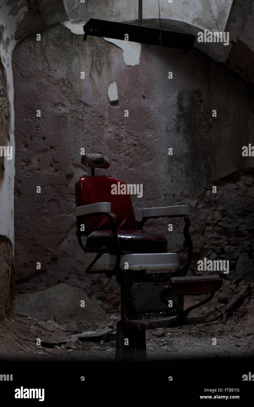 How about a fresh shave? A barber's chair at the Eastern State Penitentiary in Philadelphia Pennsylvania Stock Photo