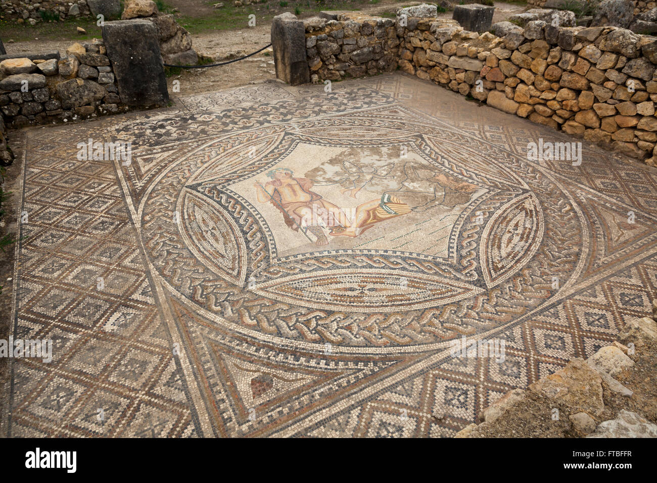 Volubilis UNESCO World Heritage Site, Morocco - Roman Ruins and mosaics. Mosaic of Bacchus encountering the sleeping Ariadne Stock Photo