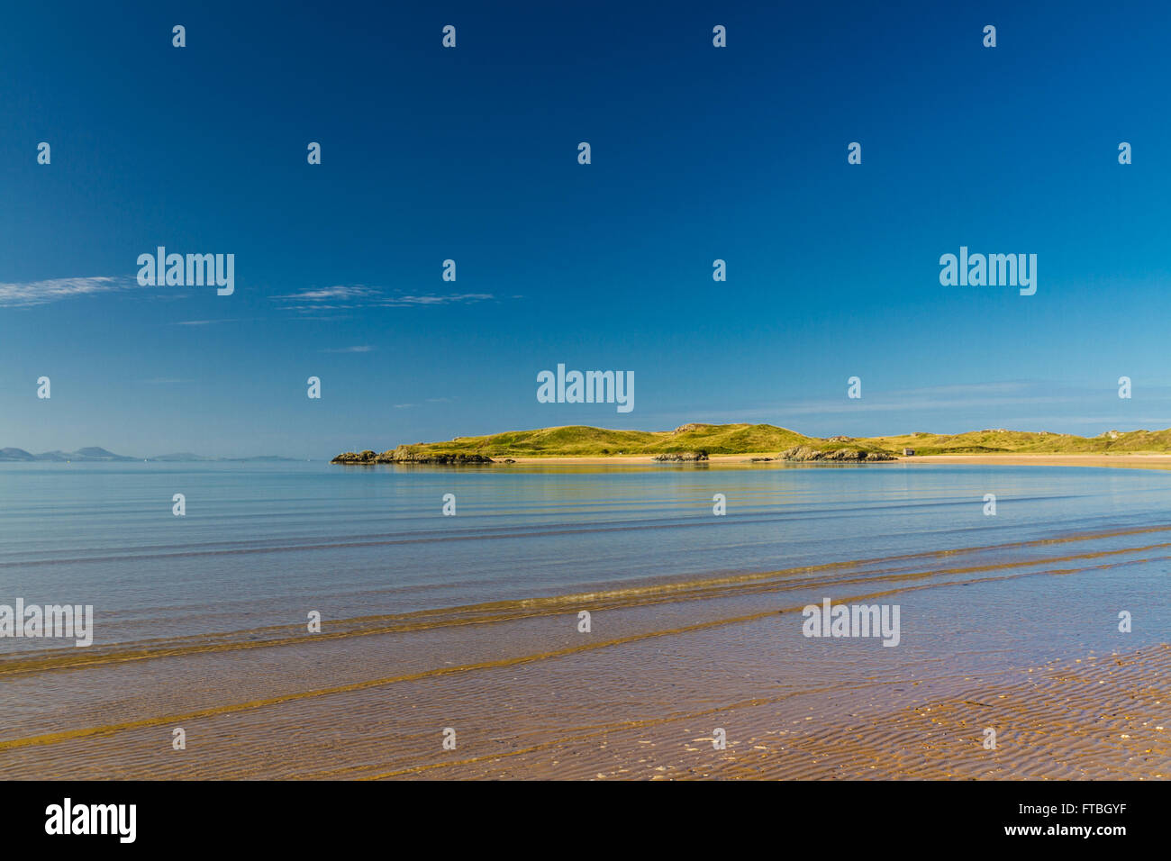 Llanddwyn Island, a peninsula on Anglesey, from sandy beach. Newborough