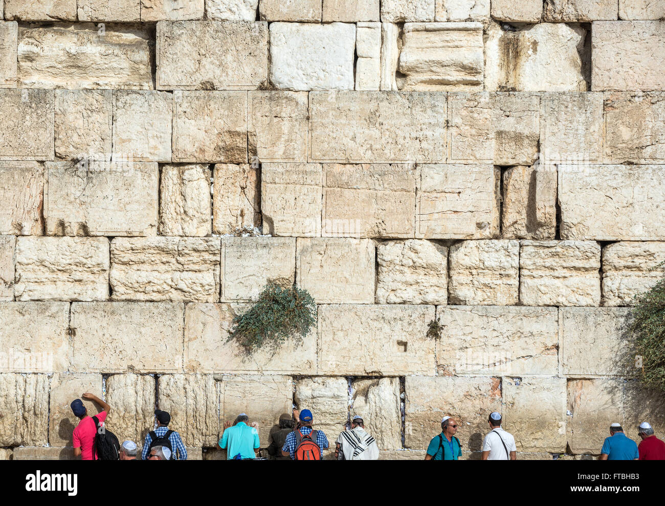 People praying at Western Wall (also called Kotel or Wailing Wall) in