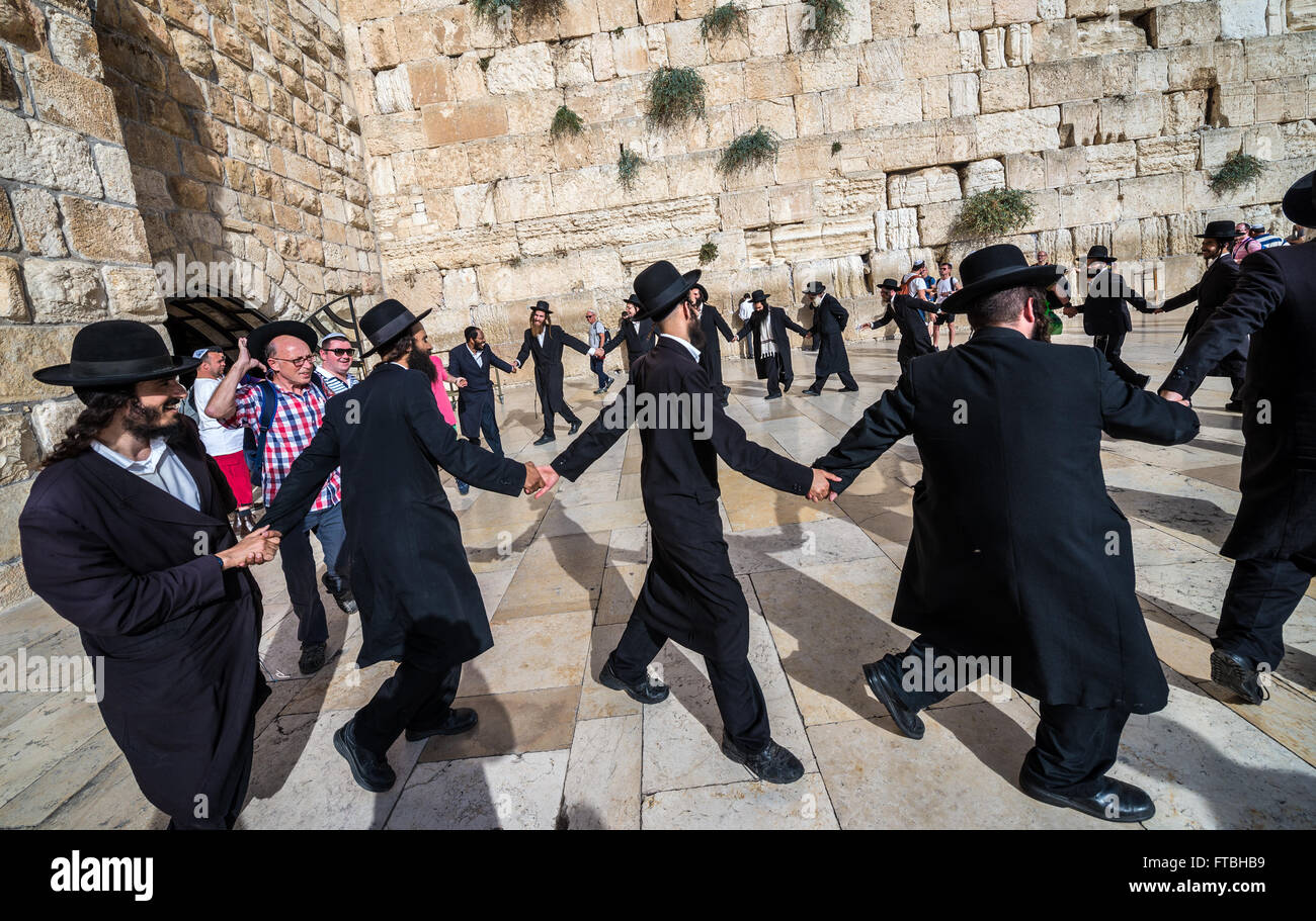 Orthodox Jews dancing in front of Western Wall (also called Kotel or ...
