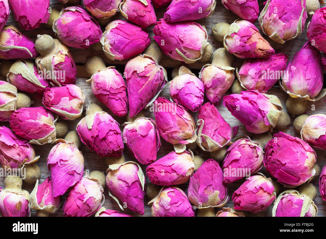 Dry rose buds tea background. Top view. Stock Photo