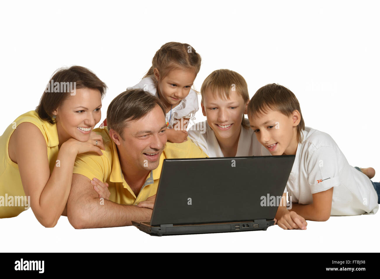 Happy family with laptop Stock Photo - Alamy