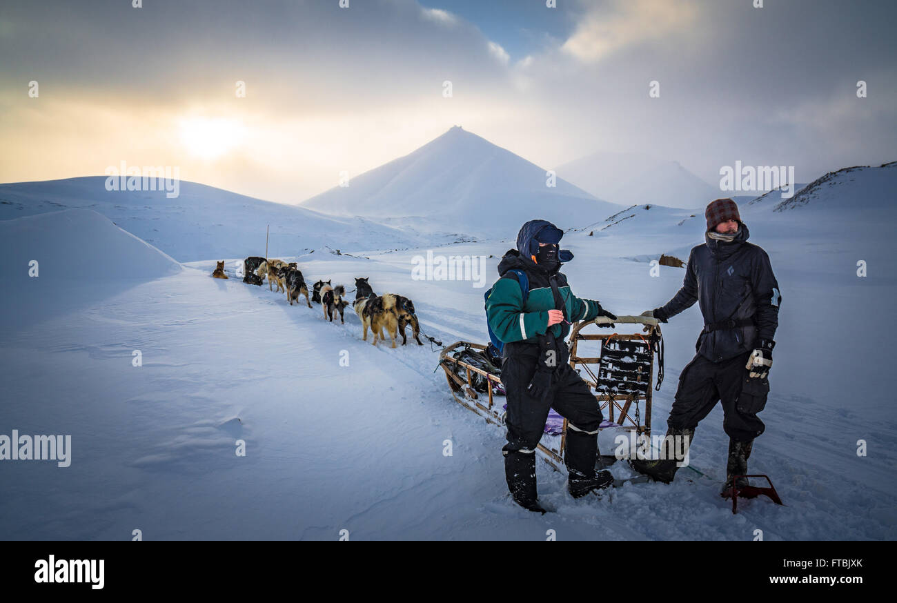 Dog sledding Scott Turnerbreen Glacier, near Longyearbyen, Spitsbergen, Svalbard Stock Photo