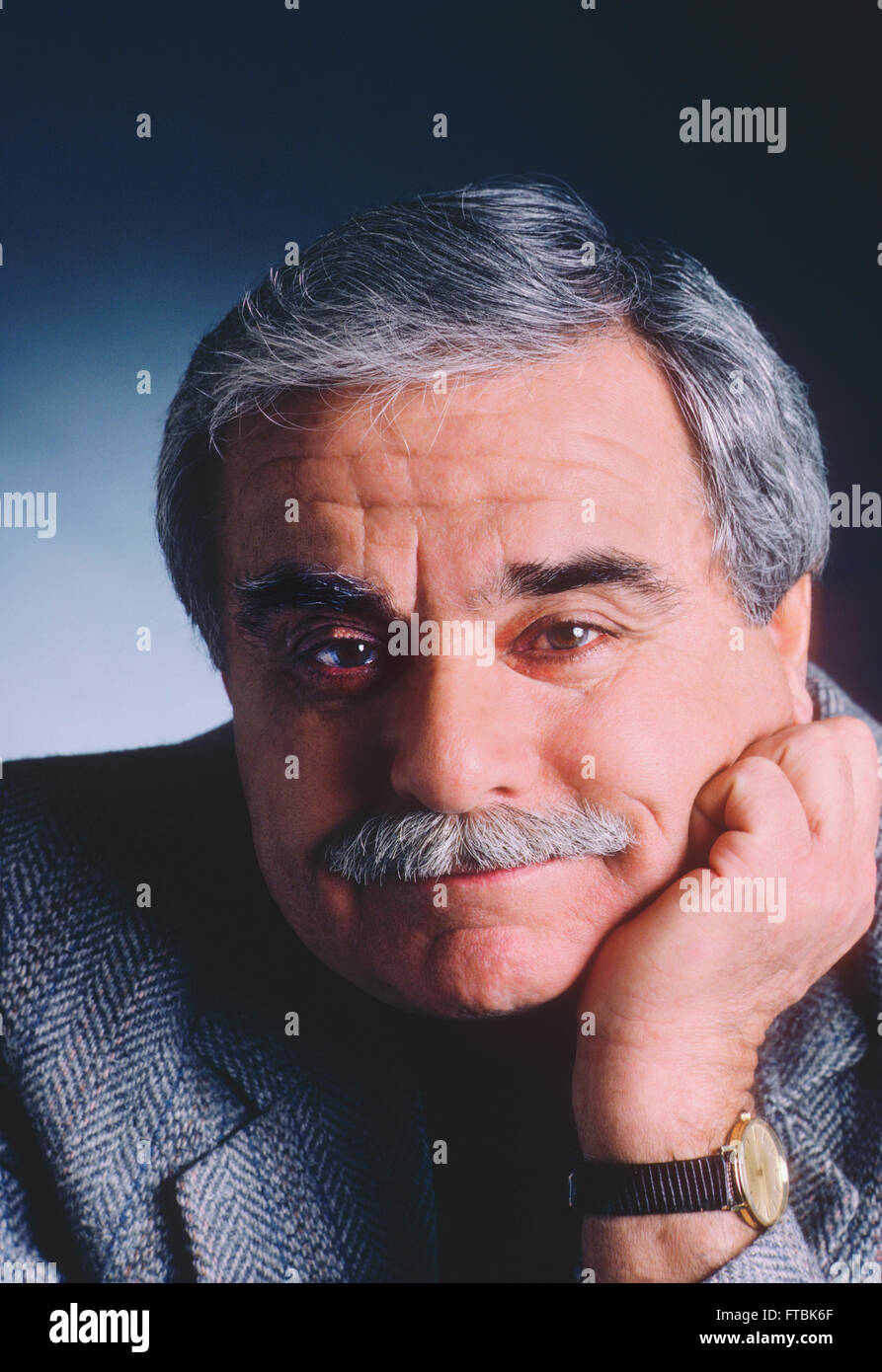 Studio portrait of distinquished older gentleman with mustache & grey hair Stock Photo