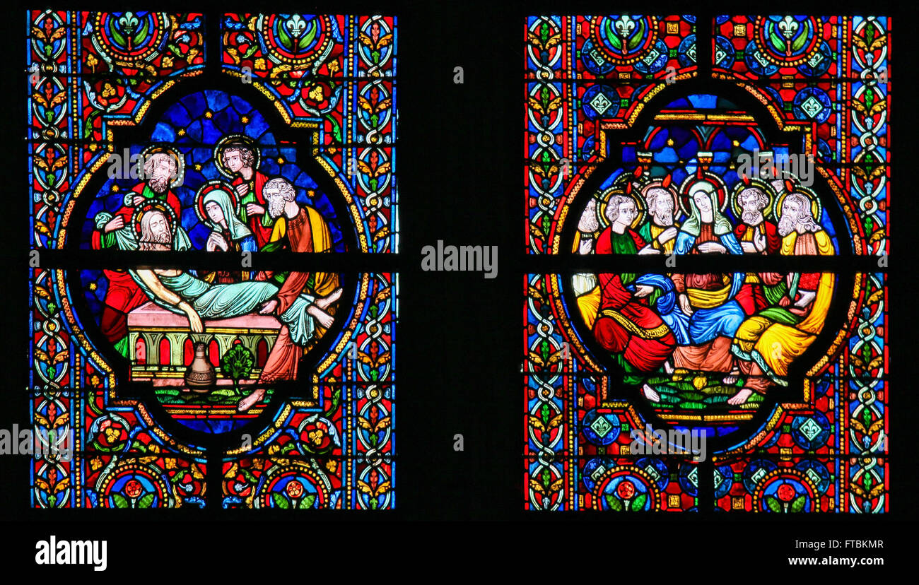 Stained glass window depicting Jesus laid in His tomb and Mother Mary ...