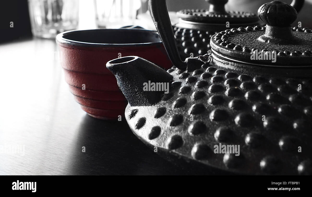 Japanese cast iron tea kettles with tea and japanese tea cup Stock