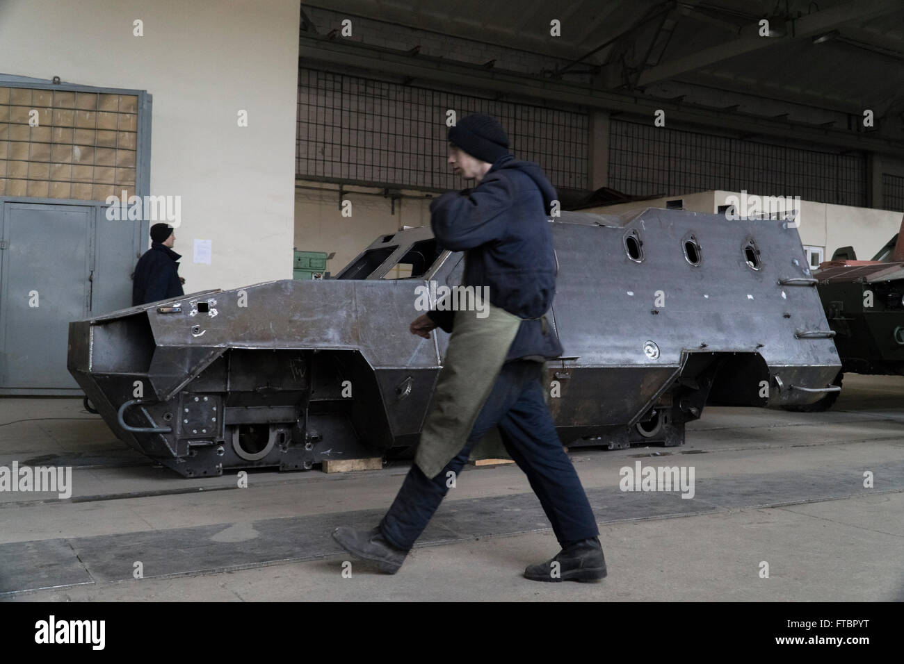 A Worker Walks Past The Production Line For Dozor-B Armoured Personnel ...