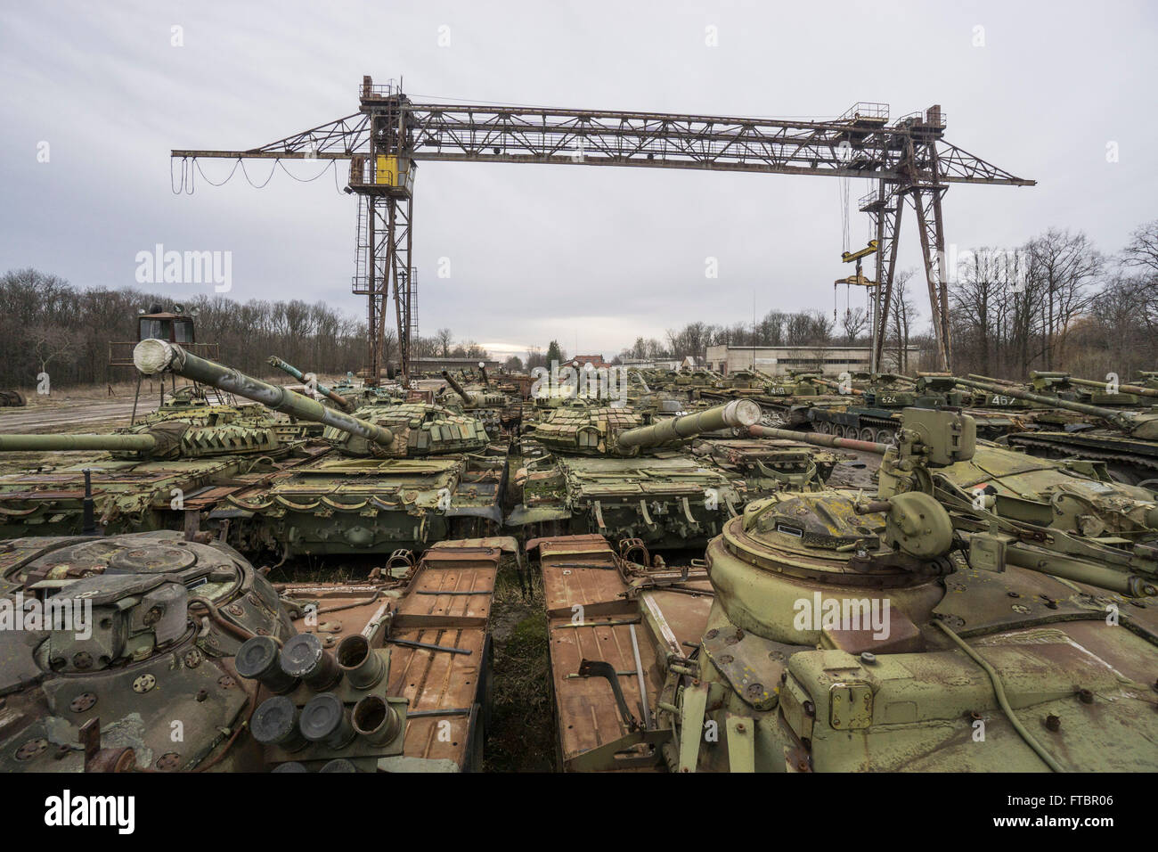 Tanks waiting for repair sit in a storage area at the Lviv Armour Plant Stock Photo