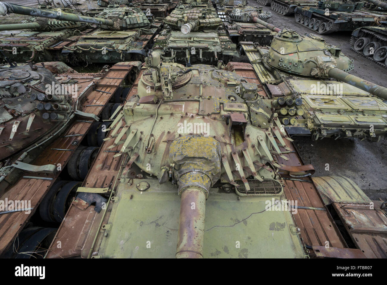 Tanks waiting for repair sit in a storage area at the Lviv Armour Plant Stock Photo