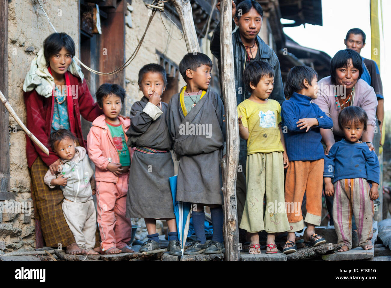 Group of children being lined up by their parents for a portrait in Korphu Village, southern Bhutan Stock Photo