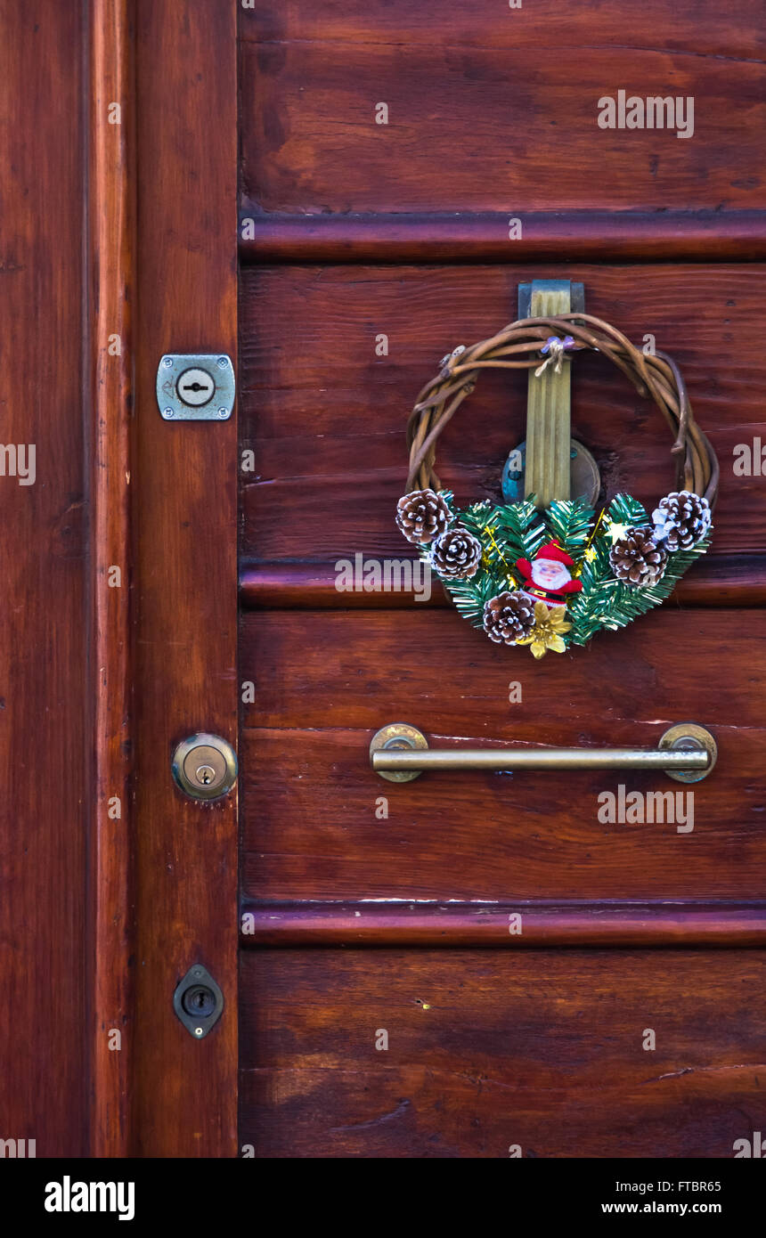 Christmas decoration on an old door at downtown of Cagliari, Sardinia Stock Photo