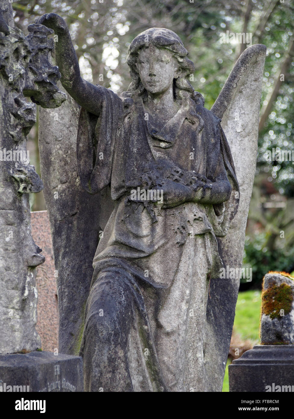 Statue of an angel in a cemetary Stock Photo